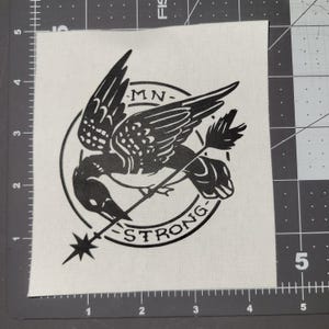 MN STRONG patch, vinyl on cotton canvas