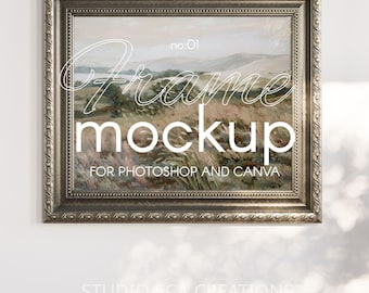 May include: A silver ornate picture frame with a landscape painting inside. The frame has a decorative border and the text "Frame mockup for Photoshop and Canva" is printed on the bottom of the frame.