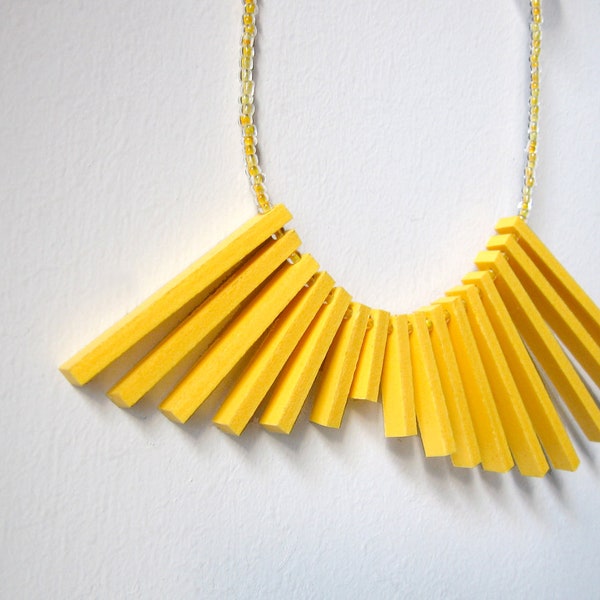 geometric yellow necklace with plastic sticks and glass beads