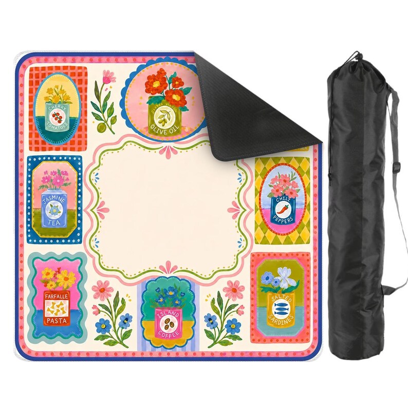 May include: A square picnic blanket featuring a cream-colored center and a border decorated with colorful illustrations of canned goods labeled Cherry Tomatoes, Olive Oil, Jasmine Tea, Chili Peppers, Farfalle Pasta, Island Coffee, and Salted Sardines.