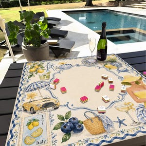 May include: A decorative table mat with a vintage Italian theme. The mat features illustrations of lemons, a yellow convertible, blueberries, and a woman in a yellow dress. A bottle of champagne and a glass are on the table, along with game pieces.