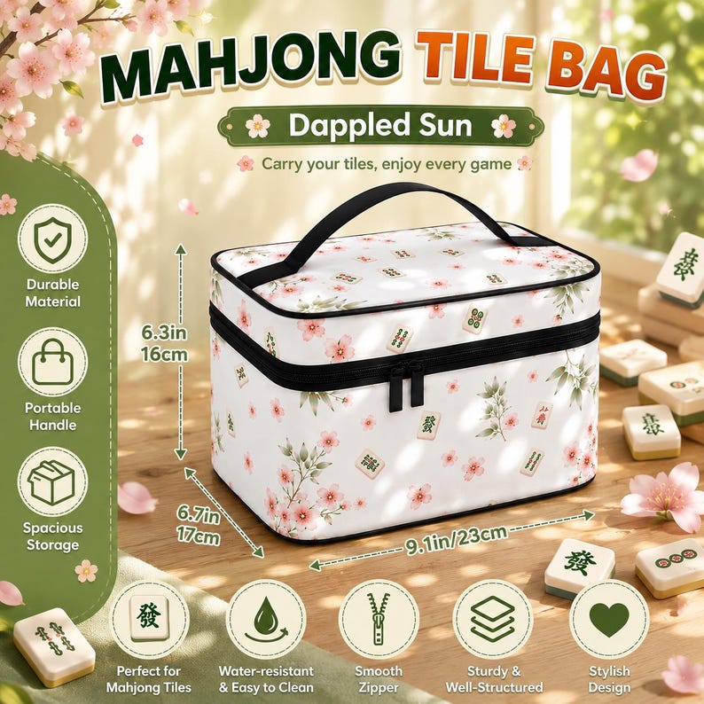 May include: A rectangular white mahjong tile bag with a pink cherry blossom and green leaf pattern, featuring a black handle and zipper. The bag measures 9.1 inches wide, 6.3 inches high, and 6.7 inches deep, with text reading Mahjong Tile Bag.