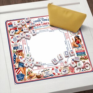 May include: A square Mahjong mat featuring a beach-themed design with illustrations of people, surfboards, and text including Let the GOOD TIMES & TAN LINES be our worries, alongside scattered white Mahjong tiles and a solid yellow zippered pouch.