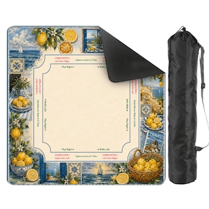 May include: A colorful game mat featuring a coastal scene with lemons, sailboats, and blue and white tiles. The mat has game instructions and comes with a black carrying bag. The mat is rectangular.