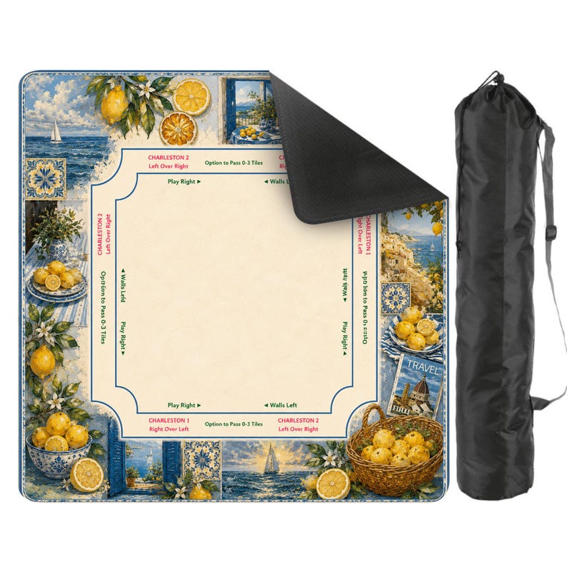 May include: A colorful game mat featuring a coastal scene with lemons, sailboats, and blue and white tiles. The mat has game instructions and comes with a black carrying bag. The mat is rectangular.