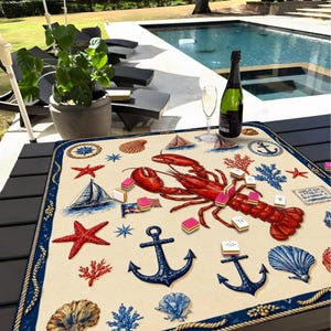 May include: A nautical-themed placemat featuring a large red lobster, anchors, seashells, sailboats, and starfish. The placemat has a cream-colored background with a blue border and is decorated with various nautical elements.