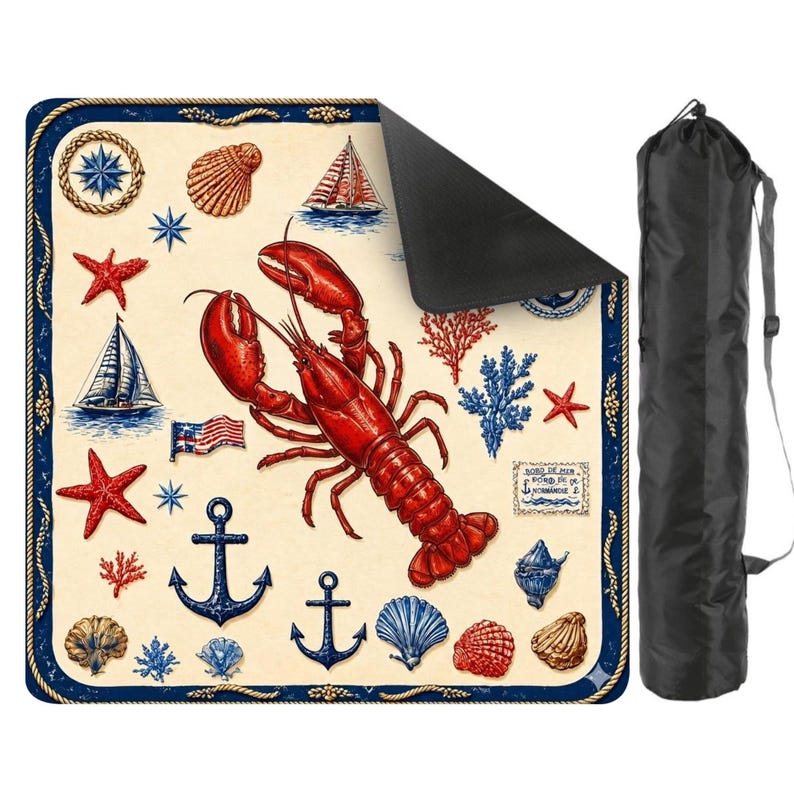 May include: A nautical-themed picnic blanket featuring a large red lobster, anchors, seashells, sailboats, and starfish. The blanket has a cream background with a blue border and comes with a black carrying bag.