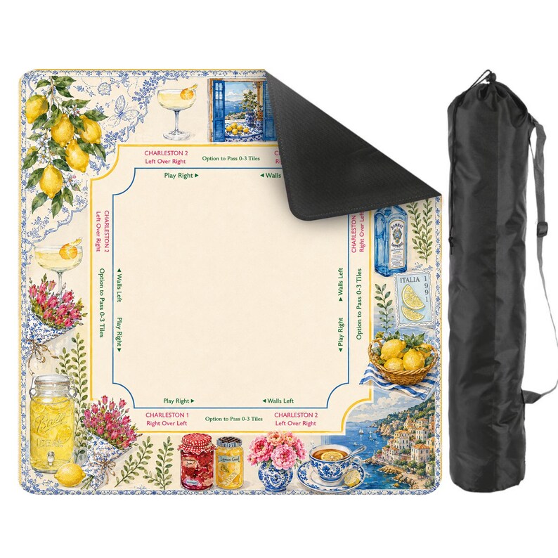 May include: A square, decorative mat with a lemon and floral design, featuring images of cocktails, lemons, and coastal scenes. Includes a black carrying bag with a shoulder strap. The mat has text that reads "Charleston" and "Italia".