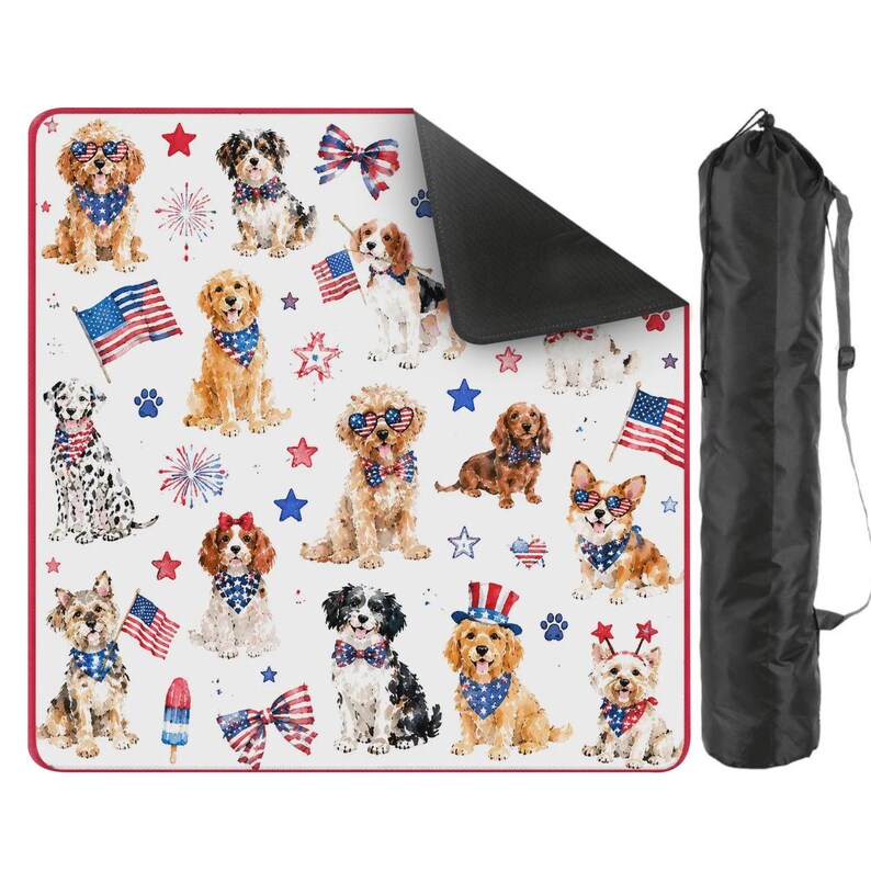 May include: A square outdoor blanket featuring a repeating pattern of various dog breeds wearing patriotic bandanas, star-shaped sunglasses, and hats, interspersed with American flags, fireworks, and stars, accompanied by a black carrying bag.