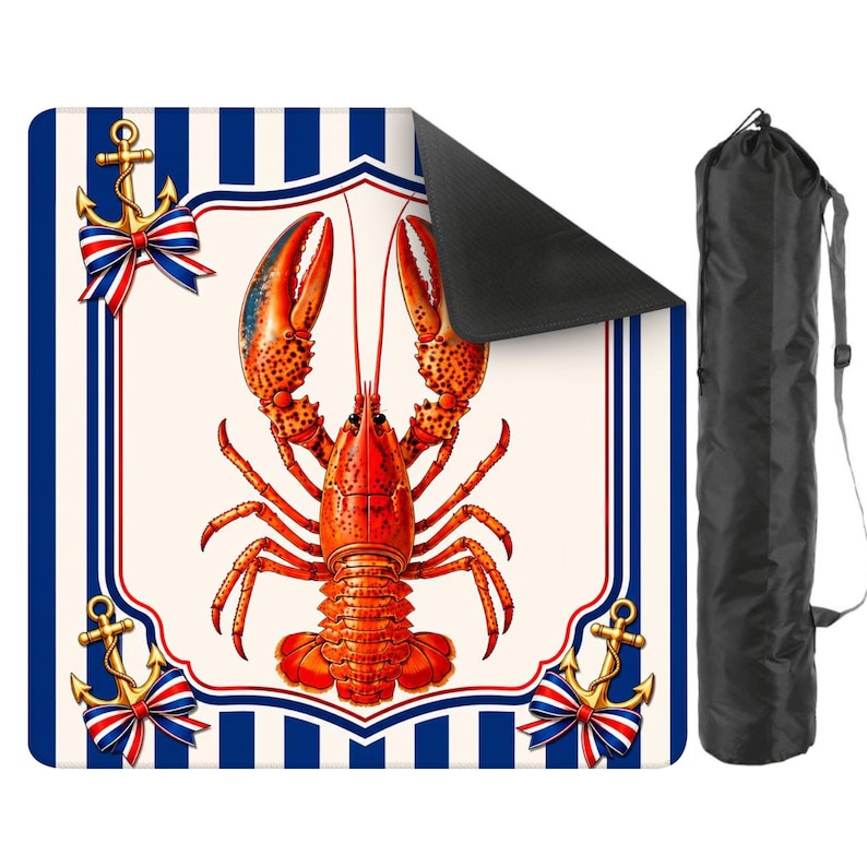 May include: A rectangular mat with a nautical theme, featuring a vibrant red lobster illustration at the center. The mat has a cream-colored background with a blue and white striped border, accented with gold anchors and red, white, and blue bows. A black carrying bag is included.