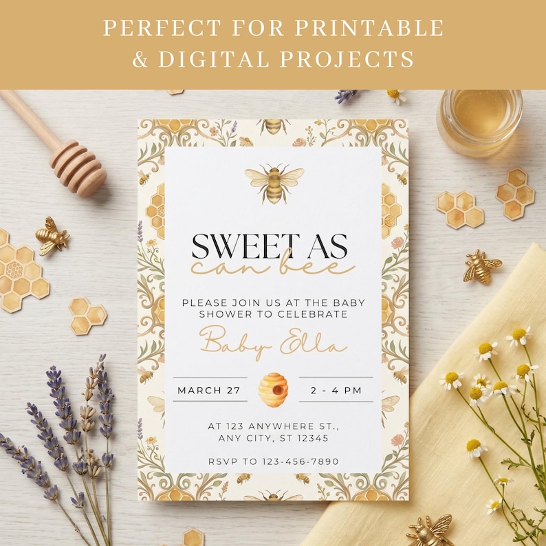 Watercolor honey bee seamless pattern used as a border on a printable baby shower invitation styled with lavender, daisies, a honey dipper, and honeycomb decorations on a neutral flat lay background.