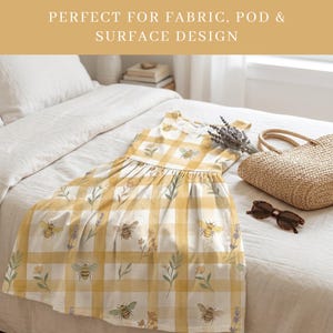 Watercolor honey bee gingham seamless pattern shown on a summer dress laid on a white bed, styled with lavender, a wicker tote bag, and sunglasses, demonstrating fabric and print on demand use.