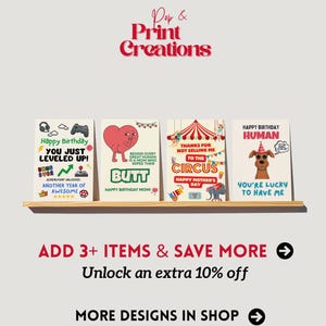 May include: A shelf displays four greeting cards with humorous messages. The cards feature playful graphics and text, including a video game theme, a heart-shaped butt, a circus, and a dog. The text on the cards includes "Happy Birthday" and "You're Lucky to Have Me."