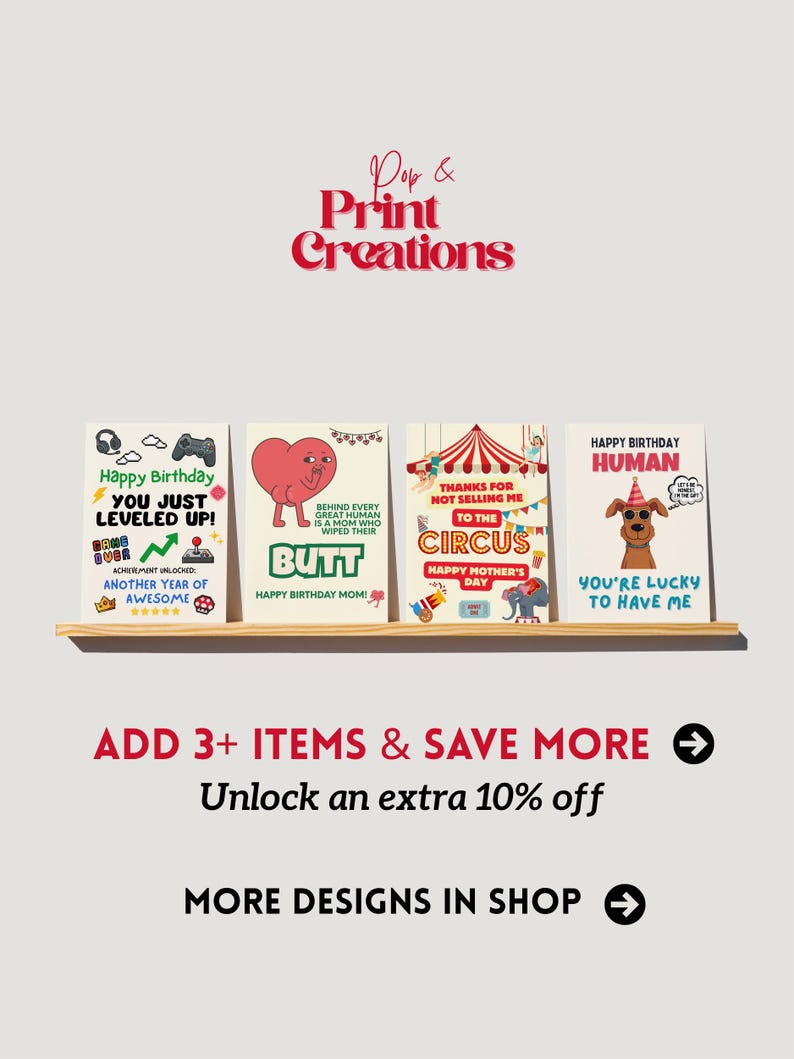 May include: A shelf displays four greeting cards with humorous messages. The cards feature playful graphics and text, including a video game theme, a heart-shaped butt, a circus, and a dog. The text on the cards includes "Happy Birthday" and "You're Lucky to Have Me."