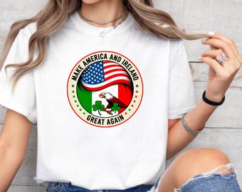 May include: White t-shirt featuring a circular graphic with the text "MAKE AMERICA AND IRELAND GREAT AGAIN." The design incorporates the American flag, the Irish flag, an eagle, and shamrocks. The shirt is a casual wear item.