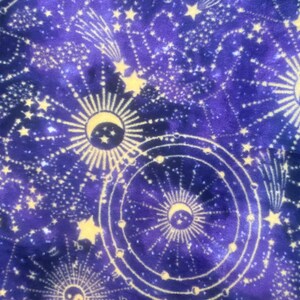 May include: Purple fabric with a gold celestial pattern. The pattern includes stars, moons, and suns.
