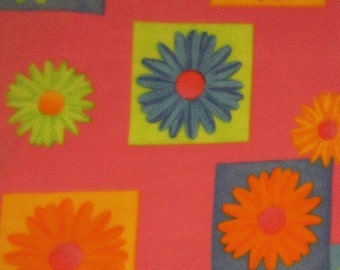 Daisys in Blue, Yellow, Orange and Green on Pink with Green Couch Throw