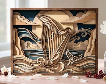 May include: A multi-layered wooden wall art piece featuring a whale shaped like a harp, set against a background of stylised waves, clouds, and a large sun. The artwork is constructed from various shades of natural wood and deep blue tones.