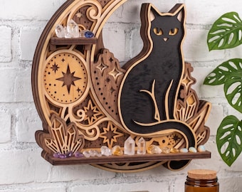 May include: A layered wooden wall shelf shaped like a crescent moon featuring a black cat silhouette, star cutouts, and small integrated shelves holding various clear and colored crystals. The design includes intricate wood grain patterns.