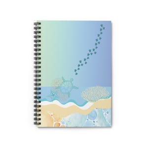 May include: Spiral-bound notebook featuring a sea turtle design. The cover has a gradient background of blue and green, with illustrations of a sea turtle, starfish, coral, and a trail of baby turtles. The notebook has a white background.
