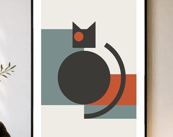 May include: A framed wall art print featuring a geometric cat illustration. The design consists of a large dark gray circle for the body, a smaller dark gray shape for the head, a single orange circular eye, and a curved black line for the tail.