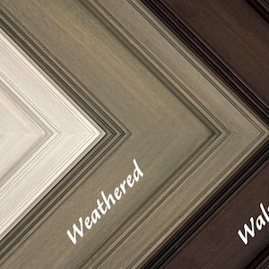 May include: Close-up of three wooden picture frame corners in different finishes: Whitewash, Weathered, and Walnut. The frames are angled, showcasing the varying textures and colors, with the names of each finish written in cursive.