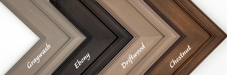 May include: A selection of wooden picture frames in various colors, including Graywash, Ebony, Driftwood, and Chestnut. Each frame has a beveled edge and is labeled with its color name in a cursive font.