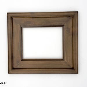 May include: A rectangular picture frame with a dark brown espresso finish. The frame has a layered design and a white interior. The word "Espresso" is printed in the bottom left corner.