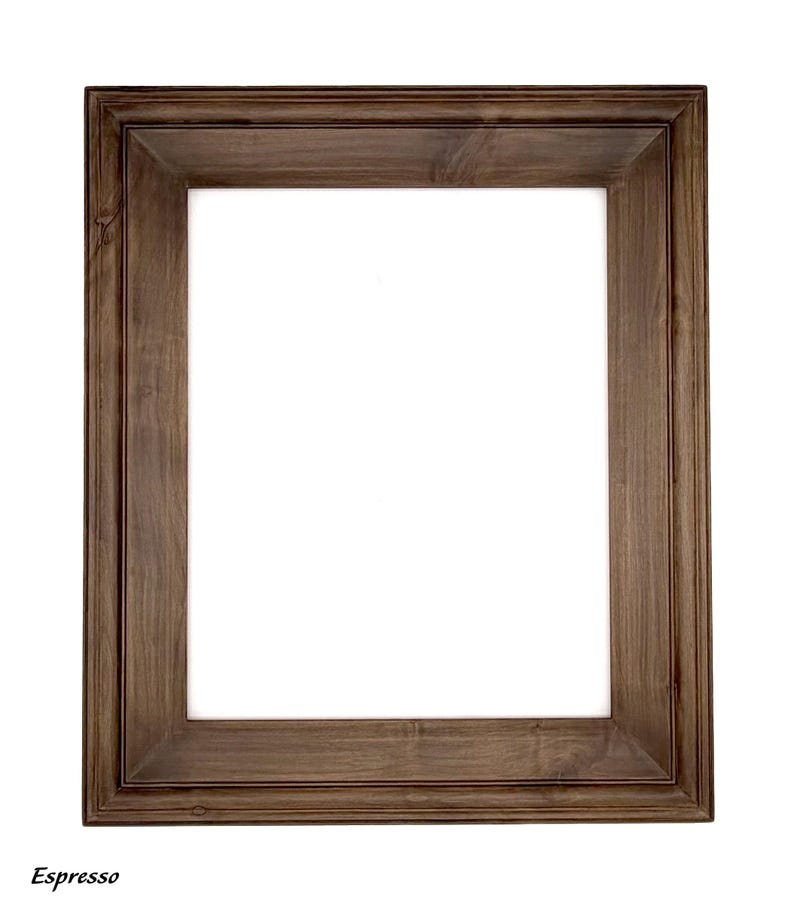 May include: A rectangular espresso-colored wooden picture frame with a white interior. The frame has a detailed, layered design and the word "Espresso" is printed at the bottom left corner.