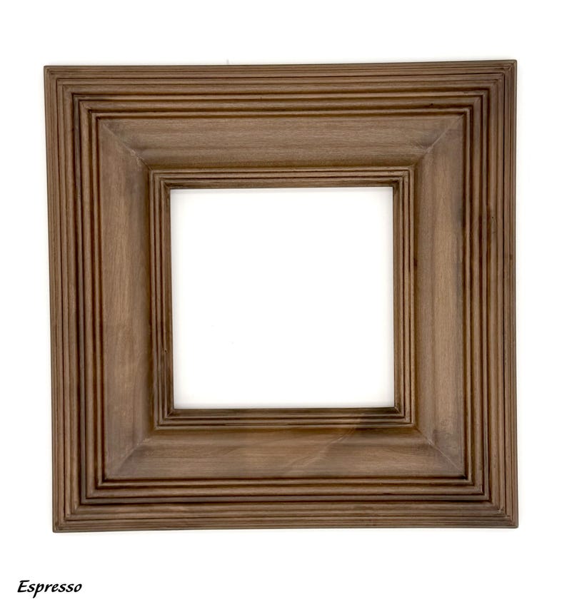 May include: Square wooden picture frame in a rich espresso finish. The frame has a layered design with a recessed inner border and a wide outer edge. The word "Espresso" is printed at the bottom.