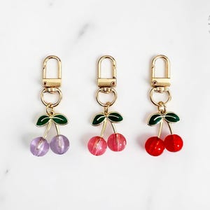 Cute Cherry Keychain for Women – Red Pink Purple Resin Fruit Pendant – Fun Bag Charm Accessory for Backpacks & Handbags