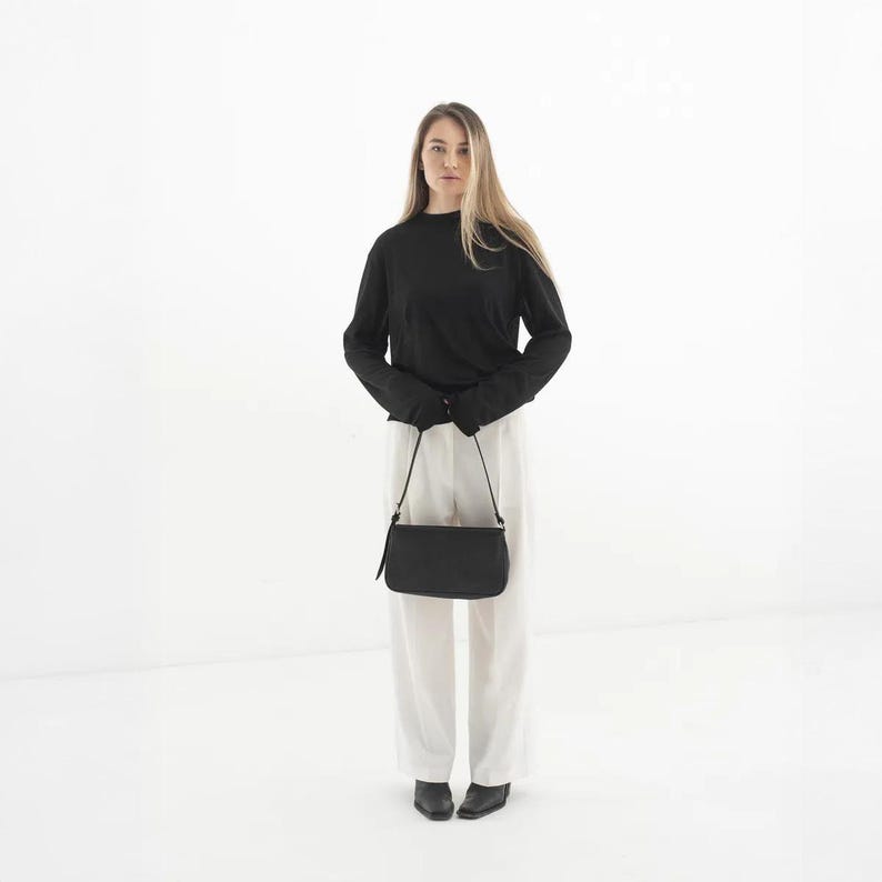 Elevate your everyday look with our Womens Leather Shoulder Bag – a handmade, minimalist design perfect for daily use. Crafted from premium leather, this small shoulder purse with zipper offers both style and practicality. Its compact size fits essentials with ease, making it a perfect casual or elegant leather bag. Click “Add to Cart” and enjoy timeless, handcrafted quality every day.