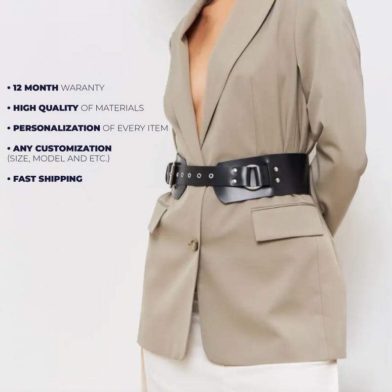 May include: A black leather belt with a wide design, featuring a large buckle and multiple eyelets. The belt is worn over a tan blazer. The image also includes text: "12 MONTH WARANTY", "HIGH QUALITY OF MATERIALS", "PERSONALIZATION OF EVERY ITEM", "ANY CUSTOMIZATION", and "FAST SHIPPING".