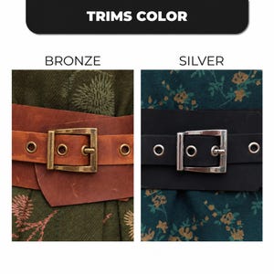 May include: Image showing two belts with different buckle colors. The left belt is brown leather with a bronze buckle. The right belt is black leather with a silver buckle. The text at the top says "TRIMS COLOR".