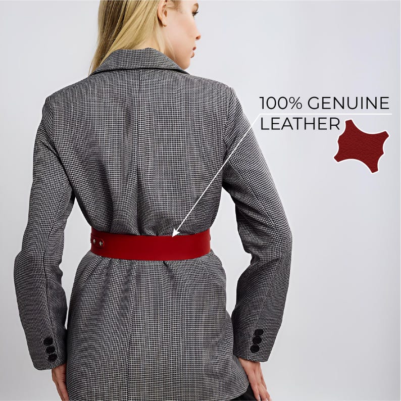 May include: A grey and white houndstooth blazer with a wide red leather belt. The belt has a simple buckle closure. The text "100% GENUINE LEATHER" is visible in the image.