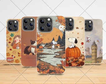 May include: Five phone cases with autumnal designs. The cases feature illustrations of a girl, a cat, Snoopy, and Big Ben. The colour palette includes orange, brown, and beige, with fall leaves and pumpkins.