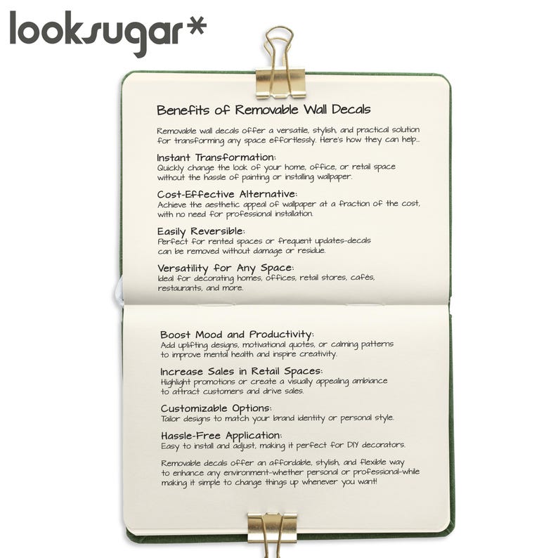 Puede incluir: Un cuaderno abierto con el texto "Benefits of Removable Wall Decals" y una lista de beneficios. El cuaderno se sujeta con un clip dorado. La marca "looksugar*" est&aacute; en la parte superior.