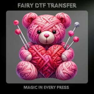 May include: A pink teddy bear made of yarn holding a heart-shaped ball of yarn. The bear has knitting needles with pink yarn balls. The text "FAIRY DTF TRANSFER" and "MAGIC IN EVERY PRESS" are at the top and bottom of the image.