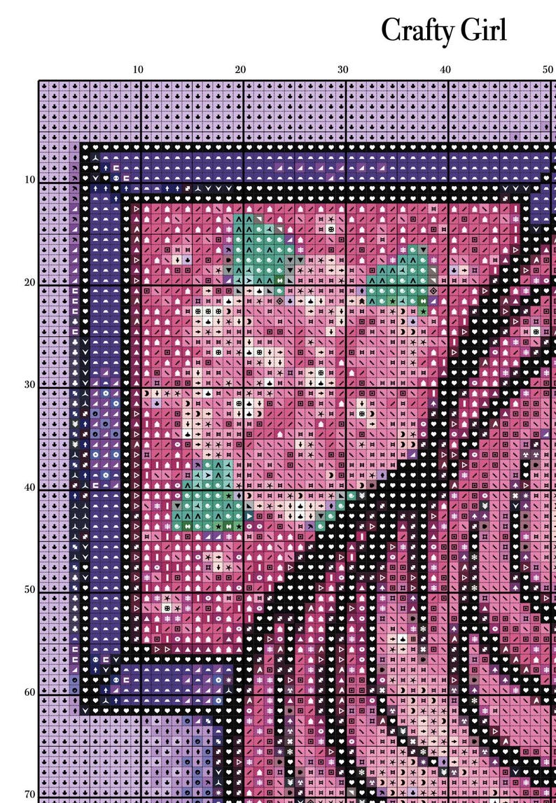 May include: A cross-stitch pattern featuring a floral design in pink, purple, and green. The words "Crafty Girl" are at the top. The pattern is on a grid, ready for stitching.