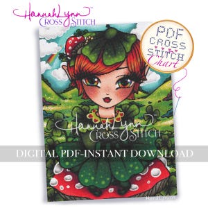 Op de afbeelding: Een kleurrijk kruissteekpatroon met een grillige fee met rood haar, groene kleding en een paddenstoelkap. Het ontwerp bevat een regenboog en de tekst "PDF Cross Stitch Chart". De woorden "Hannah Lynn Cross Stitch" zijn ook zichtbaar.