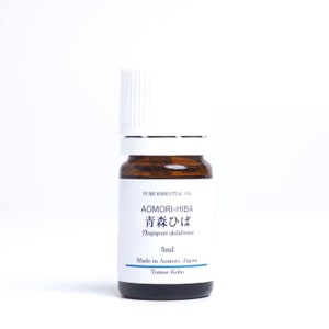 May include: A brown glass bottle with a white cap containing Aomori-Hiba essential oil. The label reads "PURE ESSENTIAL OIL AOMORI-HIBA 青森ひば Thujopsis dolabrata 5ml Made in Aomori, Japan Tomoe Kobo".