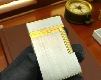 Briquet au butane de luxe : outil d'allumage rechargeable en argent et en or - Un son inspiré