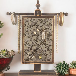 Handcrafted Earring Holder with Diamond Design hanging on Necklace Stand with jewelry attached. By Earring Holder Gallery.