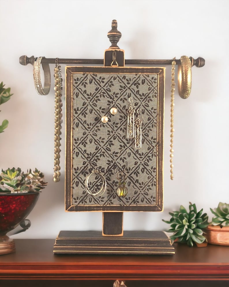 Handcrafted Earring Holder with Diamond Design hanging on Necklace Stand with jewelry attached. By Earring Holder Gallery.