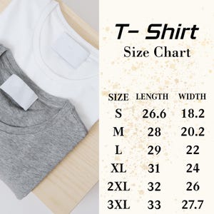 May include: Two t-shirts, one white and one gray, are displayed on a wooden surface. The image includes a size chart with measurements for length and width in inches for sizes S through 3XL. The text "T-Shirt Size Chart" is also visible.