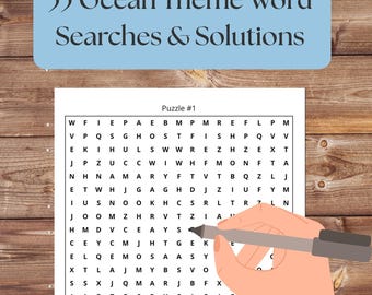 May include: A word search puzzle on white paper with ocean-themed words. The title reads "55 Ocean Theme Word Searches & Solutions." A hand holds a pen over the puzzle. The words to find are listed below the puzzle.