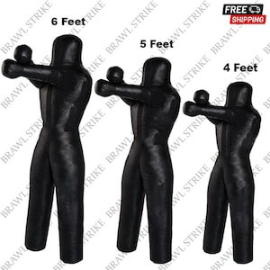 May include: Three black freestanding punching bags in different sizes. The bags are made of leather and have a realistic human shape. The bags are labelled with their heights: 6 feet, 5 feet, and 4 feet.