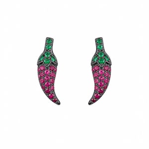 May include: A pair of chili pepper-shaped earrings. The earrings are black with a curved shape, and are encrusted with small, round, green and pink gemstones. The gemstones are arranged to mimic the shape and color of a chili pepper.