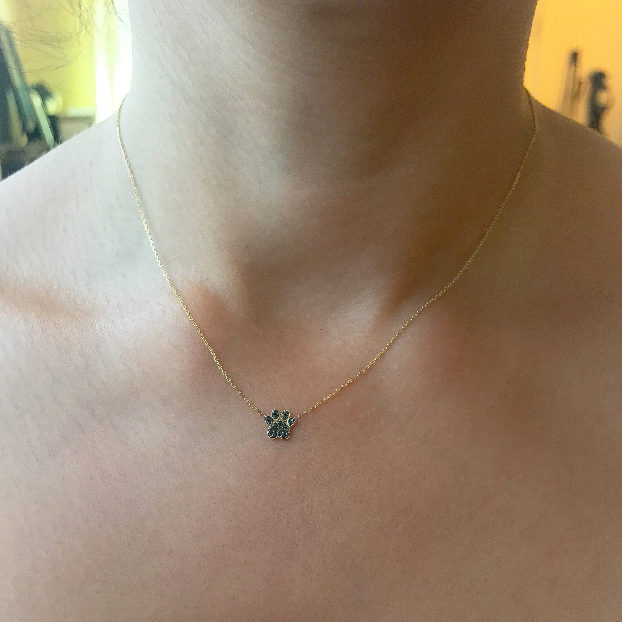 Black diamond paw print necklace hotsell