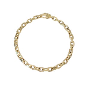 May include: A gold chain bracelet with a box chain design. The bracelet has a lobster clasp closure.